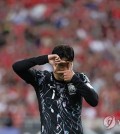 Son Heung-min of South Korea celebrates after scoring against Singapore during the teams' Group C match in the second round of the Asian World Cup qualification at the National Stadium in Singapore on June 6, 2024. (Yonhap)