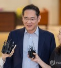 Samsung Electronics Co. Chairman Lee Jae-yong (C) speaks to reporters at Gimpo International Airport in western Seoul on June 13, 2024. (Yonhap)