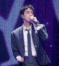 Jin, a member of K-pop supergroup BTS, returned to the spotlight with a heartfelt reunion with fans Thursday, just a day after completing his mandatory military service. The meet-and-greet event for 4,000 fans at the Jamsil Indoor Gymnasium in southern Seoul was part of the larger 2024 BTS Festa, an annual festival celebrating the anniversary of the band's debut. Riding onto the stage on a bicycle, reminiscent of a scene from the music video for Jin's debut solo single, "The Astronaut," the singer opened the event with the song, which was met with thunderous applause and cheers from the audience. BTS member Jin gestures during a meet-and-greet event for fans at the Jamsil Indoor Gymnasium in southern Seoul on June 13, 2024, in this photo provided by BigHit Music. (PHOTO NOT FOR SALE) (Yonhap) BTS member Jin gestures during a meet-and-greet event for fans at the Jamsil Indoor Gymnasium in southern Seoul on June 13, 2024, in this photo provided by BigHit Music. (PHOTO NOT FOR SALE) (Yonhap) The emotional moment saw Jin, visibly moved, expressing his joy and nervousness about being back. "I've finally returned to the home I longed for so much. It feels like I'm debuting again. I can't sing well. My face and hands are shaking. It's chaos," Jin told the crowd. This year's festival also included his hug session for 1,000 fans who won a raffle event, which preceded the "fan meeting" during the day. Jin's participation in the in-person events marked a significant moment as he was the first of the BTS members to complete his military service and return to public life. Acknowledging the challenges of readjusting after military life, Jin asked for patience and understanding from his fans. "Since I was discharged yesterday, I'm still not well adjusted. So I would be grateful if you could forgive me generously even if I make mistakes or perform poorly," he said. "It's so hard. Guys, where are you? I miss you," he added humorously, in reference to his fellow BTS members. BTS member Jin sings during a meet-and-greet event for fans at the Jamsil Indoor Gymnasium in southern Seoul on June 13, 2024, in this photo provided by BigHit Music. (PHOTO NOT FOR SALE) (Yonhap) BTS member Jin sings during a meet-and-greet event for fans at the Jamsil Indoor Gymnasium in southern Seoul on June 13, 2024, in this photo provided by BigHit Music. (PHOTO NOT FOR SALE) (Yonhap) "Hearing that I was coming to the stage, many of you must have been happy. I had a lot to say when meeting ARMY. Being together, receiving your cheers, my heart gradually feels at ease," he said, referring to the name of the band's devoted fandom. During the event, Jin also shared about his time in the military, where he bonded with younger servicemen, whom he jovially asked to call him "Uncle." Concluding the "fan meeting" event, Jin once again expressed his gratitude and excitement about being back on stage and reunited with the fans. "I'll always stay with you. I'll be your light, constantly revolving around ARMY," he said. Fans of K-pop supergroup BTS attend a meet-and-greet event involving BTS member Jin at the Jamsil Indoor Gymnasium in southern Seoul on June 13, 2024, in this photo provided by BigHit Music. (PHOTO NOT FOR SALE) (Yonhap) Fans of K-pop supergroup BTS attend a meet-and-greet event involving BTS member Jin at the Jamsil Indoor Gymnasium in southern Seoul on June 13, 2024, in this photo provided by BigHit Music. (PHOTO NOT FOR SALE) (Yonhap)