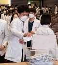 In this file photo, medical professors at Korea University submit their resignations in Seoul on March 25, 2024. (Yonhap)