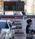 In this file photo, a signboard at a gas station in Seoul shows gasoline and diesel prices on March 31, 2024. (Yonhap)