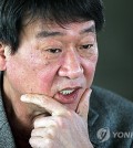 Singer-songwriter and playwright Kim Min-ki is seen in this file photo taken Feb. 21, 2011. (Yonhap)