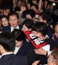 Lawmakers of the ruling People Power Party protest against a hearing on an online petition calling for the impeachment of President Yoon Suk Yeol, as Rep. Jung Chung-rae, chair of the parliamentary legislation and judiciary committee, heads to a meeting room at the National Assembly in Seoul to attend the hearing on July 19, 2024. (Yonhap)
