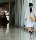 A medical staff member walks down a hallway at a general hospital in Seoul on July 21, 2024. (Yonhap)