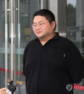 Lee Jun-hee, known by his YouTube channel name Gujeyeok, appears before the prosecutors' office before heading to the Suwon District Court in Suwon, 30 kilometers south of Seoul, to attend an arrest warrant hearing on July 26, 2024. (Yonhap)