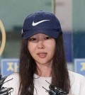 This file photo taken July 9, 2024, shows ADOR CEO Min Hee-jin stepping out of a police station in Yongsan, Seoul, after an investigation of breach of duty charges against her. (Yonhap)