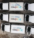 This file photo taken April 12, 2024, shows Coupang delivery trucks at a parking lot in Seoul. (Yonhap)