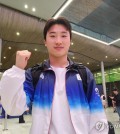 South Korean diver Woo Haram poses for a photo after an interview with Yonhap News Agency after arriving at Paris Charles de Gaulle Airport in Paris for the Paris Olympics on July 26, 2024. (Yonhap)