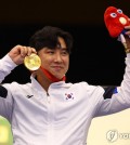 In this Reuters photo, Jo Jeong-du of South Korea celebrates with his gold medal won in the men's 10-meter air pistol (SH1 classification) event at the Paris Paralympics at the Chateauroux Shooting Centre in Chateauroux, France, on Aug. 30, 2024. (Yonhap)