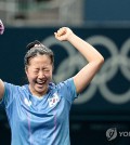 Shin Yu-bin of South Korea celebrates her win over Miu Hirano of Japan in the quarterfinals of the women's singles table tennis event at the Paris Olympics at South Paris Arena 4 in Paris on Aug. 1, 2024. (Yonhap)