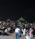 Citizens stay overnight at Gyeongpo Beach along the northeast coast in the early hours of Aug. 4, 2024, as a tropical night occurred for the 17th consecutive day in the city of Gangneung, 163 kilometers east of Seoul. (Yonhap)