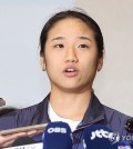 In this file photo from Aug. 7, 2024, South Korean badminton player An Se-young speaks with reporters at Incheon International Airport, west of Seoul, after returning home with the women's singles gold medal from the Paris Olympics. (Yonhap)