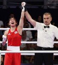 Im Ae-ji of South Korea (L) celebrates after beating Yeni Arias of Colombia (R) in the quarterfinals of the women's 54-kilogram boxing event at the Paris Olympics at North Paris Arena in Paris on Aug. 1, 2024. (Yonhap)