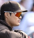 Aug 21, 2024; San Diego, California, USA; San Diego Padres shortstop Ha-Seong Kim (7) looks on during the first inning against the Minnesota Twins at Petco Park. Mandatory Credit: Orlando Ramirez-USA TODAY Sports