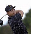 Sep 26, 2024; Ile Bizard, Quebec, CAN; Tom Kim of the International team tees off on the second hole during the first round of The Presidents Cup golf tournament. Mandatory Credit: Eric Bolte-Imagn Images