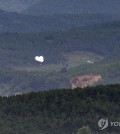 Balloons carrying trash float over North Korea's border county of Kaepung, in this photo taken from South Korea's border city of Paju, some 30 kilometers northwest of Seoul, on Sept. 5, 2024. (Yonhap)