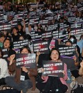 Participants hold a rally on responding to deepfake sex crimes on Telegram, hosted by the Korea Women's Hot Line on Sept. 6, 2024. (Yonhap)