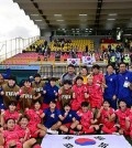 South Korean players and coaches celebrate their 1-0 win over Germany in their Group D match at the FIFA U-20 Women's World Cup at Estadio El Techo in Bogota, Colombia, on Sept. 7, 2024, in this photo provided by the Korea Football Association. (PHOTO NOT FOR SALE) (Yonhap)