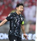 Son Heung-min of South Korea celebrates after scoring against Oman during the teams' Group B match in the third round of the Asian World Cup qualification at Sultan Qaboos Sports Complex in Muscat on Sept. 10, 2024. (Yonhap)