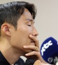 Suwon FC player Son Jun-ho pauses to gather himself during a press conference in Suwon, south of Seoul, on Sept. 11, 2024, claiming his innocence in light of China's decision to ban him for life over match-fixing charges. (Yonhap)