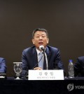 MBK Partners Vice Chairman Kim Kwang-il (C) and Young Poong President Kang Sung-doo (L) hold a press conference in Seoul on Sept. 19, 2024. (Yonhap)