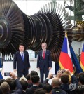 President Yoon Suk Yeol (L) and Czech Prime Minister Petr Fiala attend a signing ceremony for agreements on nuclear energy industry cooperation at Doosan Skoda Power, a nuclear energy contractor in Plzen, an industrial city about 90 kilometers west of Prague, on Sept. 20, 2024. (Yonhap)