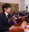 Hong Myung-bo, head coach of the South Korean men's national football team, answers a question before the parliamentary committee on culture, sports and tourism at the National Assembly in Seoul on Sept. 24, 2024. (Yonhap)