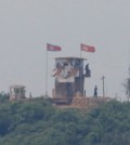 FILE PHOTO: North Korean soldiers are seen at their guard post inside North Korean territory, in this picture taken from Paju, South Korea, near the demilitarized zone (DMZ) separating the two Koreas, June 17, 2020. REUTERS/Kim Hong-Ji/File Photo