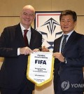 FIFA President Gianni Infantino (L) and Korea Football Association (KFA) President Chung Mong-gyu pose for a photo after their meeting at the KFA headquarters in Seoul on Oct. 28, 2024, in this photo provided by the KFA. (PHOTO NOT FOR SALE) (Yonhap)