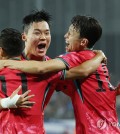 Oh Hyeon-gyu of South Korea (C) celebrates with teammates Moon Seon-min (L) and Lee Jae-sung after scoring against Iraq during the teams' Group B match in the third round of the Asian World Cup qualification at Yongin Mireu Stadium in Yongin, Gyeonggi Province, on Oct. 15, 2024. (Yonhap)