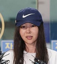 In this file photo, Min Hee-jin, former CEO of K-pop label ADOR, answers reporters' questions after undergoing police questioning at Yongsan Police Station in Seoul on July 9, 2024. (Yonhap)