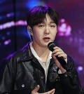 BTOB's Lee Chang-sub sings "Old Town," one of the two lead tracks of his first full-length album, "1991," during a media showcase in Seoul on Oct. 2, 2024. (Yonhap)