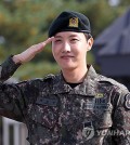 BTS member J-Hope salutes outside the main gate of the 36th Army Infantry Division in Wonju, some 90 kilometers southeast of Seoul, on Oct. 17, 2024, after completing his mandatory military service. (Yonhap)