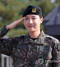 BTS member J-Hope salutes outside the main gate of the 36th Army Infantry Division in Wonju, some 90 kilometers southeast of Seoul, on Oct. 17, 2024, after completing his mandatory military service. (Yonhap)