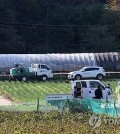 Officials control entry to a poultry farm in Donghae, about 185 kilometers east of Seoul, in this file photo taken Oct. 30, 2024, following an outbreak of highly pathogenic avian influenza. (Yonhap)