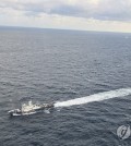 A Coast Guard vessel searches for missing crew members aboard the 129-ton Geumseong that sank off Jeju Island on Nov. 8, 2024, in this photo provided by the Jeju Coast Guard. (PHOTO NOT FOR SALE) (Yonhap)