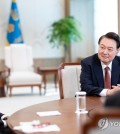 President Yoon Suk Yeol (R) speaks during an interview with Newsweek at the presidential office in Seoul in this photo provided by his office on Nov. 8, 2024. (PHOTO NOT FOR SALE) (Yonhap)