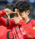 Son Heung-min of South Korea celebrates after scoring against Kuwait during the teams' Group B match in the third round of the Asian World Cup qualification at Jaber Al-Ahmad International Stadium in Kuwait City on Nov. 14, 2024. (Yonhap)