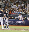 South Korean reliever Lee Young-ha (L) and catcher Park Dong-won react after Lee gave up a two-run single to Shugo Maki of Japan during the teams' Group B game at the World Baseball Softball Confederation Premier12 at Taipei Dome in Taipei on Nov. 15, 2024. (Yonhap)