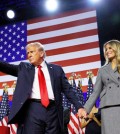 Republican presidential nominee and former U.S. President Donald Trump gestures as he holds hands with his wife Melania during his rally, at the Palm Beach County Convention Center in West Palm Beach, Florida, U.S., November 6, 2024. REUTERS/Brian Snyder TPX IMAGES OF THE DAY