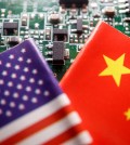 FILE PHOTO: Flags of China and U.S. are displayed on a printed circuit board with semiconductor chips, in this illustration picture taken February 17, 2023. REUTERS/Florence Lo/Illustration/File Photo