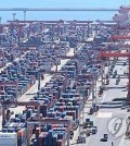 This Sept. 30, 2024, file photo shows shipping containers stacked at a port in the southeastern city of Busan. (Yonhap)