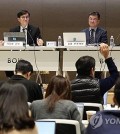 Bank of Korea Gov. Rhee Chang-yong (L) listens to a question from a reporter in a press conference at the bank's headquarters in Seoul on Dec. 18, 2024. (Yonhap)