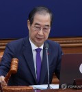 Acting President Han Duck-soo bangs the gavel during a Cabinet meeting at the government complex in central Seoul on Dec. 17, 2024. (Pool photo) (Yonhap)