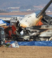 Authorities investigate the wreckage of a crashed Jeju Air plane at Muan International Airport in the southwestern county, 288 kilometers south of Seoul, on Dec. 30, 2024. (Yonhap)