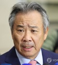 In this file photo from Nov. 13, 2024, Lee Kee-heung, suspended president of the Korean Sport & Olympic Committee, speaks to reporters at Incheon International Airport, west of Seoul. (Yonhap)