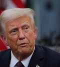 U.S. President Donald Trump speaks on the day he signs documents as he issues executive orders and pardons for January 6 defendants in the Oval Office at the White House on Inauguration Day in Washington, U.S., January 20, 2025. REUTERS/Carlos Barria