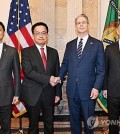 South Korea's Finance Minister Choi Sang-mok (2nd from L), Trade Minister Ahn Duk-geun (L), U.S. Treasury Secretary Scott Bessent (2nd from R) and U.S. Trade Representative (USTR) Jamieson Greer pose for a photo prior to their trade talks in Washington on April 24, 2025, in this photo provided by Seoul's industry ministry. (PHOTO NOT FOR SALE) (Yonhap)