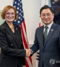 Cho Chang-rae (R), South Korea's deputy defense minister for policy, poses for a photo with Cara Abercrombie, the U.S. acting deputy under secretary of defense for policy, prior to the fourth session of the Nuclear Consultative Group in Washington, D.C., on Jan. 10, 2025, in this file photo provided by South Korea's defense ministry. (PHOTO NOT FOR SALE) (Yonhap)