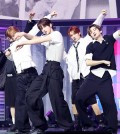 K-pop boy group TWS performs the lead track of its third EP, "Try With Us," at a concert venue in Seoul on April 21, 2025. (Yonhap)